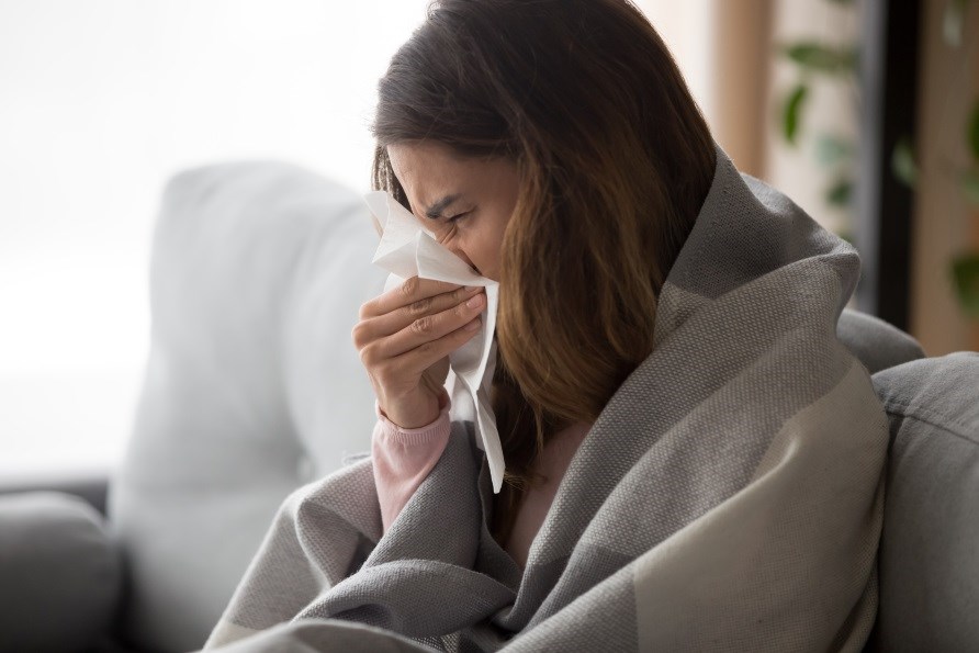 Woman with a cold blows her nose. Woman with a cold blows her nose.